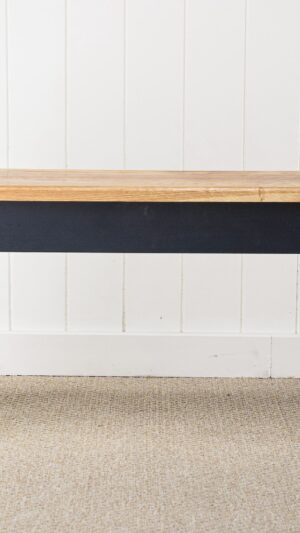 A black table with wooden top and legs.