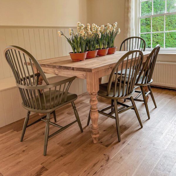 Traditional Windsor carver chairs and Windsor chairs around a farmhouse table