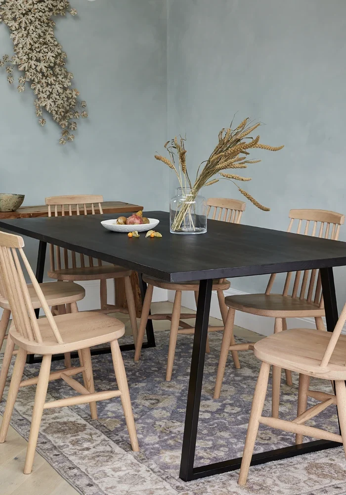 Scandinavian dining chairs around a contemporary dining table
